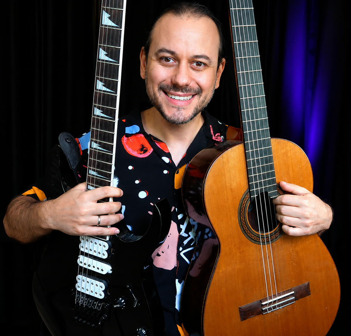 Dr. Eduardo Costa with classical and electric guitars